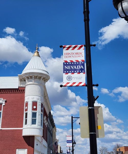 Sponsored Banner hanging on a light pole in Nevada Main Street